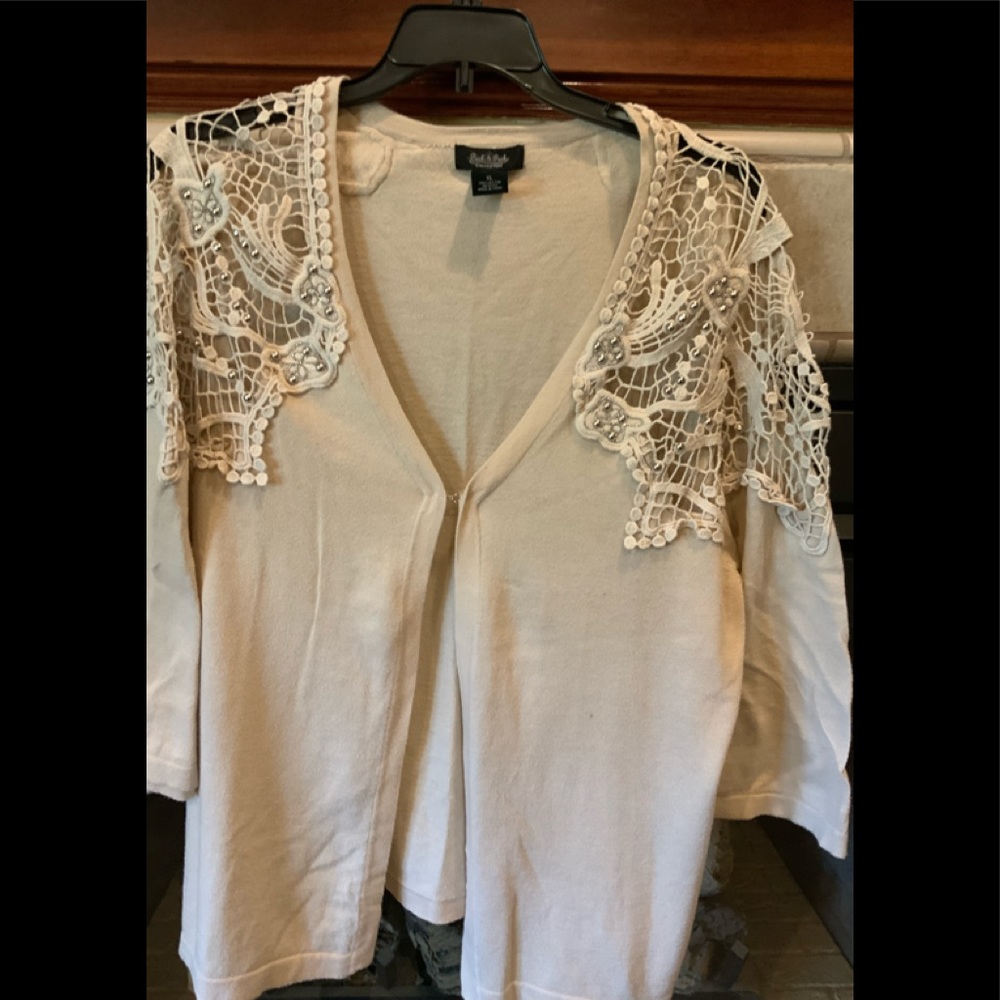 Sweater with lots of detail.